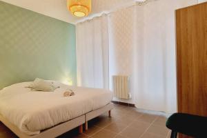 Appartements *l'Oasis du Coeur de Ville*Spacieux et moderne : photos des chambres