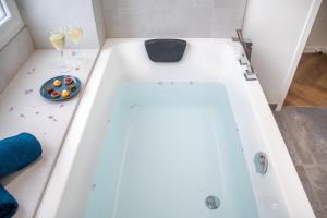 Appartements L'Appartement des Ducs avec Baignoire Double : photos des chambres