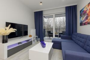 Dark Blue and Grey Apartment with Pastel Bedroom in Warsaw by Renters