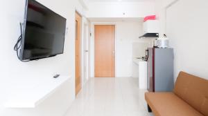 Best Choice 2BR at Puncak Permai Apartment Surabaya By Travelio