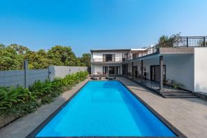 SaffronStays Mayfair Gardens - 4BR pet-friendly pool villa with patio, den, board games & modern interiors near jetty