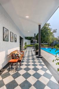 SaffronStays Mayfair Gardens - 4BR pet-friendly pool villa with patio, den, board games & modern interiors near jetty