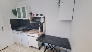 Appartements Studio Charmant - 3 min de DISNEYLAND : photos des chambres