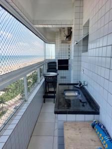 APARTAMENTO TOTALMENTE DE FRENTE AO MAR EM PRAIA GRANDE SP