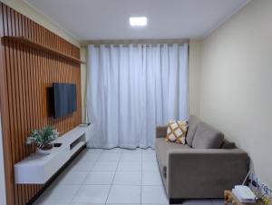 Prainha Aconchegante apto de quarto e sala com vista para o mar