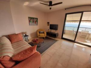 Top-Floor Beachfront Apartment with Parking, Pool, & Spacious Sea-View Balcony