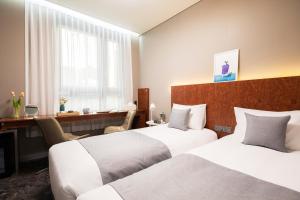 Phòng Hai Giường Đơn Loại Sang (Deluxe Twin Room)