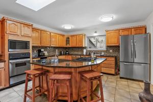 Captivating Continental Country Club Retreat with 4 BDR and Spacious deck!