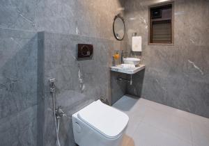 SaffronStays Peshwaai - 5BR Karjat villa with lawn pool & terrace plunge, mezzanine family rooms, near Songiri & Kondhana