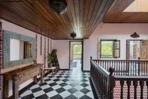 SaffronStays Peshwaai - 5BR Karjat villa with lawn pool & terrace plunge, mezzanine family rooms, near Songiri & Kondhana