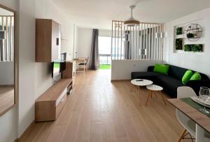 Modern open-plan studio with terrace and sea view