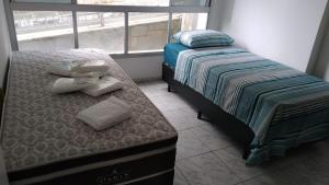 Apartamento com 4 quatros em frente a praia em Pitangueiras - Guarujá