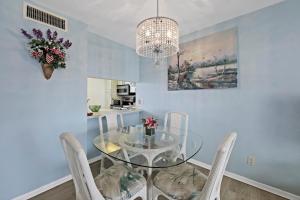 Coastal style condo with pool, spa and steps to beach