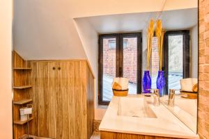 Appartements Nid douillet a 30 metres de la grande plage de Houlgate - RESIDENCE LA VAGUE - : photos des chambres