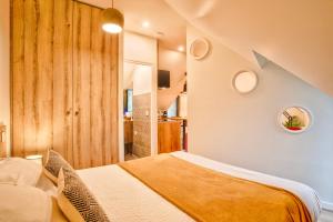 Appartements Nid douillet a 30 metres de la grande plage de Houlgate - RESIDENCE LA VAGUE - : photos des chambres