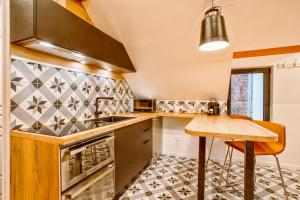 Appartements Nid douillet a 30 metres de la grande plage de Houlgate - RESIDENCE LA VAGUE - : photos des chambres