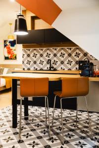 Appartements Nid douillet a 30 metres de la grande plage de Houlgate - RESIDENCE LA VAGUE - : photos des chambres