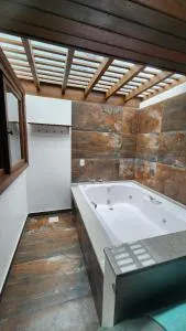 Pousada Águas de Ibiraquera Suíte Ribanceira - 因比图巴