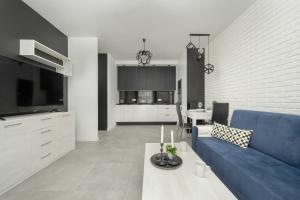 Black and White Apartment Close to the River in Wrocław by Renters