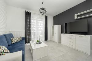 Black and White Apartment Close to the River in Wrocław by Renters