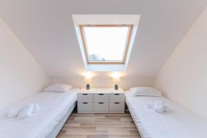 Maisons de vacances TY KREIZH - Maison neuve avec piscine proche mer : photos des chambres