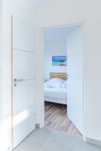 Maisons de vacances TY KREIZH - Maison neuve avec piscine proche mer : photos des chambres