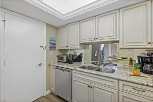 Rare beachfront condo with pool, social room and grill