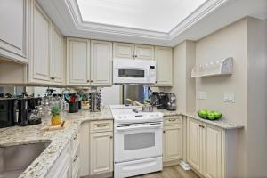 Rare beachfront condo with pool, social room and grill