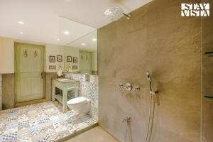 Sea Breeze by StayVista - Beachside bliss with a splash of creativity with Pool, gazebo, lush lawn, and an artistically inspired house