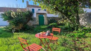 Villas Jolie maison avec parking et jardin au coeur de Loix : photos des chambres