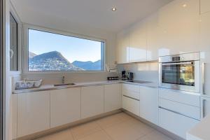 IMPERIAL of LUGANO 3 with a lake view behind the station and 10 min from the lake of Lugano