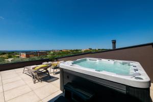 Villa Arestea near Pula with 35 m2 heated pool, sea view, wellness & kids playground