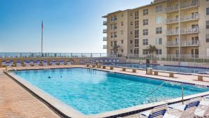 Top Floor Ocean and Pool Views located on No-Drive Beach with 2 Complex Pools