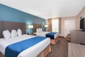 Queen Room with Two Queen Beds room in Grand Hotel Orlando at Universal Blvd