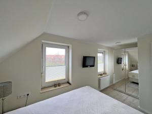 Deichblick 6 in Norddeich- Urlaub mit Meerblick am Strand