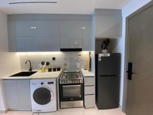 White and gold studio apartment in Binghatti Canal whit pool