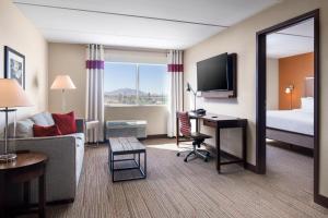 One-Bedroom King Suite with Sofa Bed and Adapted Tub - Mobility Accessible room in Four Points by Sheraton at Phoenix Mesa Gateway Airport