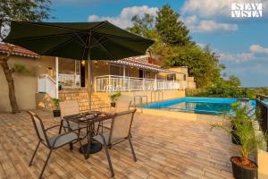 StayVista's Harvest Haven - Pool-View Villa with Deck & Machan near Sula