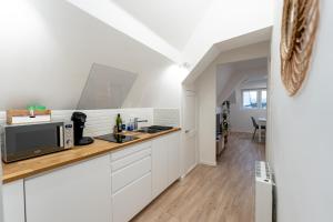 Appartements Le petit Giennois : photos des chambres