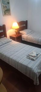 Apartamento Lia Pitangueiras Centro Guarujá , 150 metros da Praia Vista Mar ap da dona lia