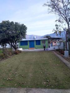 Nature Stay-The Himalayan Foot Hills-JANAKI SADAN Two Bed Room Garden Home with attached bath room in each room and Kitchen with garden facing dinning space with Badminton Court in Mango Orchard