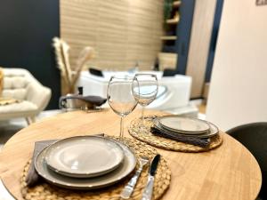 Appartements Suite Cosy Jacuzzi Troyes - Secrets d'Ana : photos des chambres