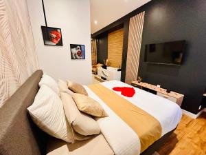 Appartements Suite Cosy Jacuzzi Troyes - Secrets d'Ana : photos des chambres