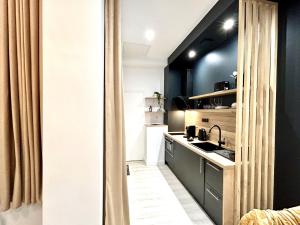 Appartements Suite Cosy Jacuzzi Troyes - Secrets d'Ana : photos des chambres