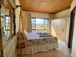 Aptos exclusivos com varanda ou terraço com Pôr do sol, cozinha privativa e equipada, Wi-Fi 600MBs, a 700m da praia de Itapirubá e 1km da BR-101