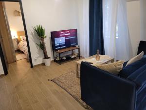 Appartements Coquet appartement a 15mn de Paris et 10 mn de Stade de France, wifi, Netflix, : photos des chambres
