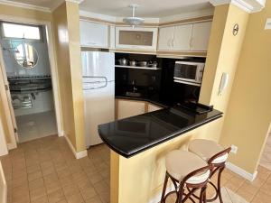 Cobertura aparthotel frente ao mar