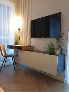 Apartments with a balcony and an impressive terrace on the roof of the house