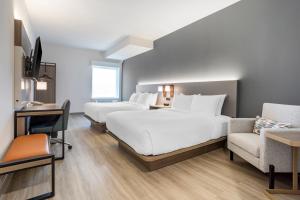 Quadruple Room with Two Queen Beds - Non Smoking room in Comfort Inn & Suites Newark Liberty International Airport