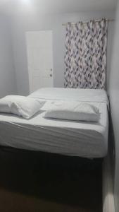 Room in a Beach House with King Size bed in a landlord hosted three bedroom apartment